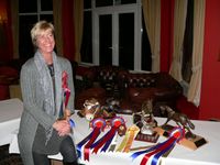 Anna Collins with her collection of trophies